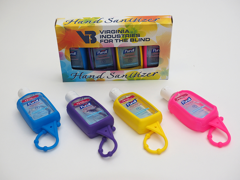 다양한 색상의 휴대용 손잡이에 진열된 퓨렐 손 소독제